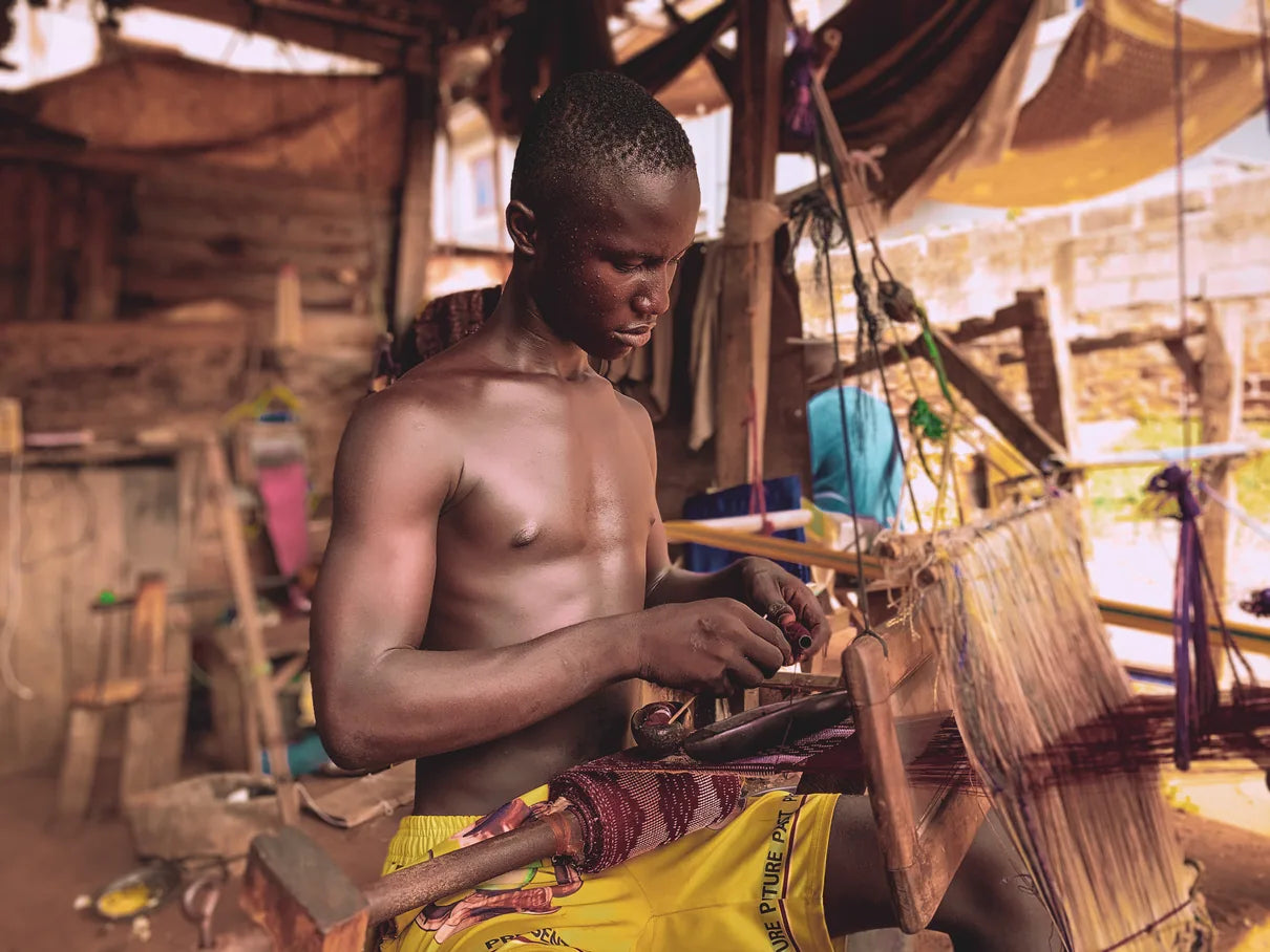 Artisan working at a loom